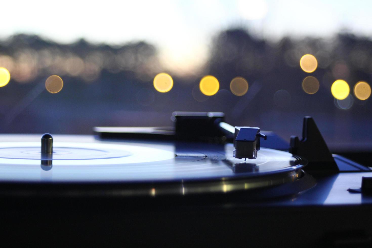 Vinyl record player spinning photo