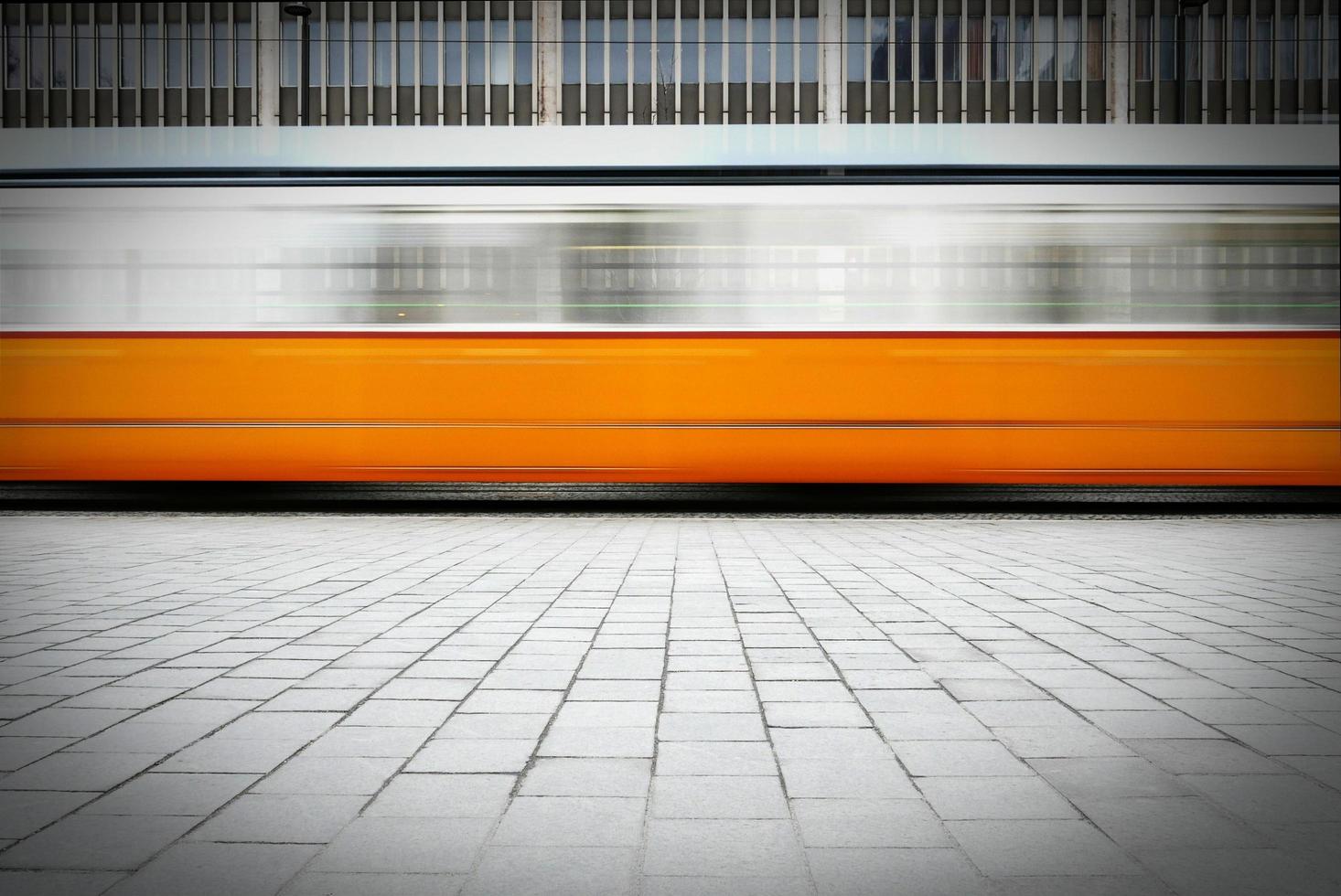 Blurred image of fast moving tram  photo