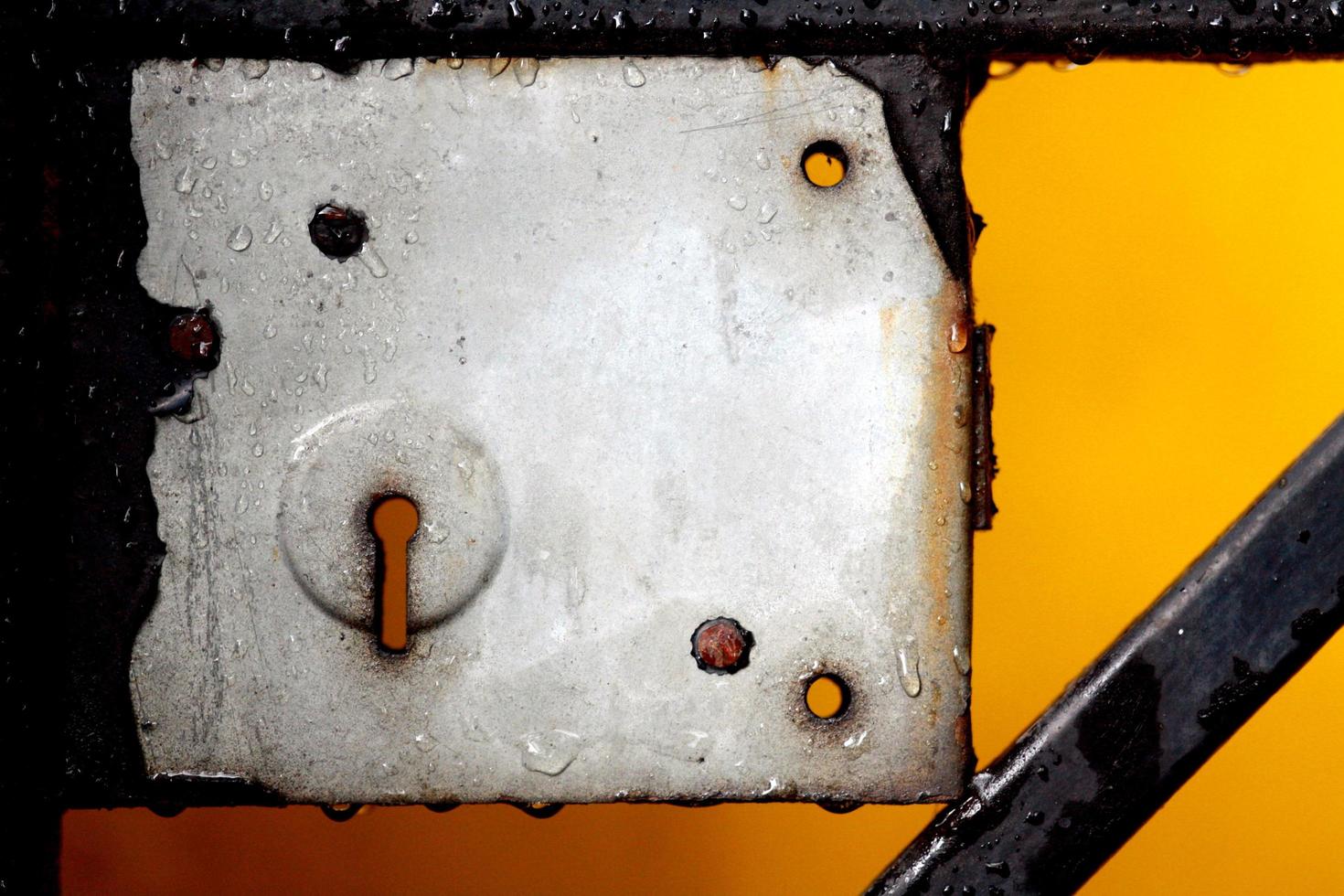 Close up view of a metal keyhole and lock photo