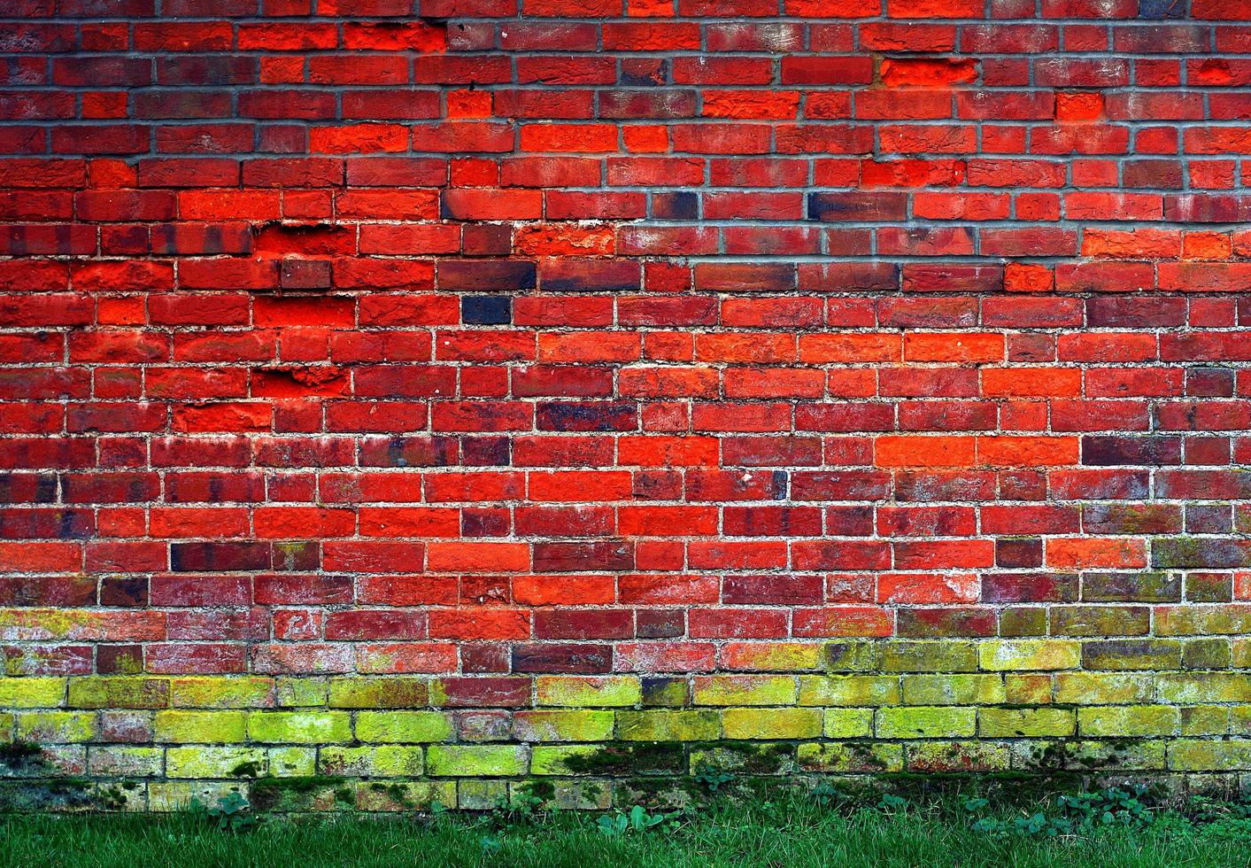 Red and green brick wall photo