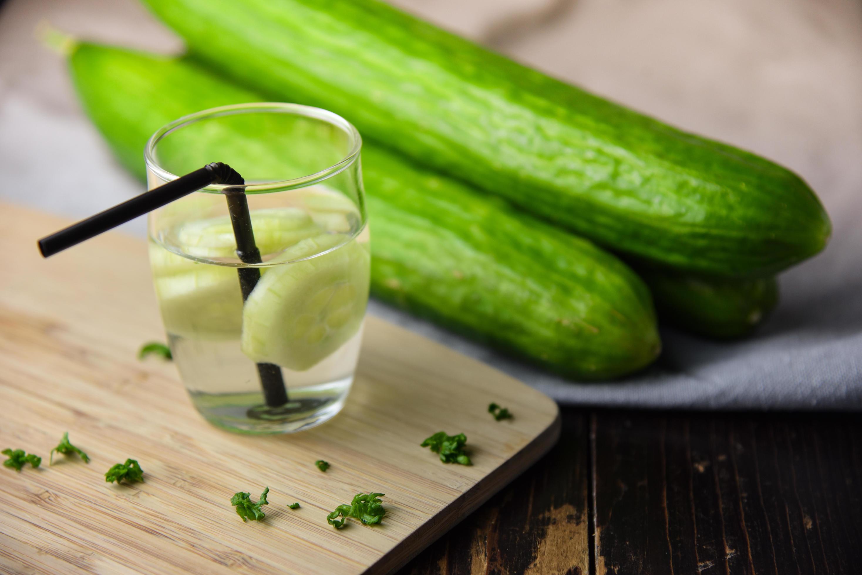 Cucumber water in glass with cucumbers 1231566 Stock Photo at Vecteezy