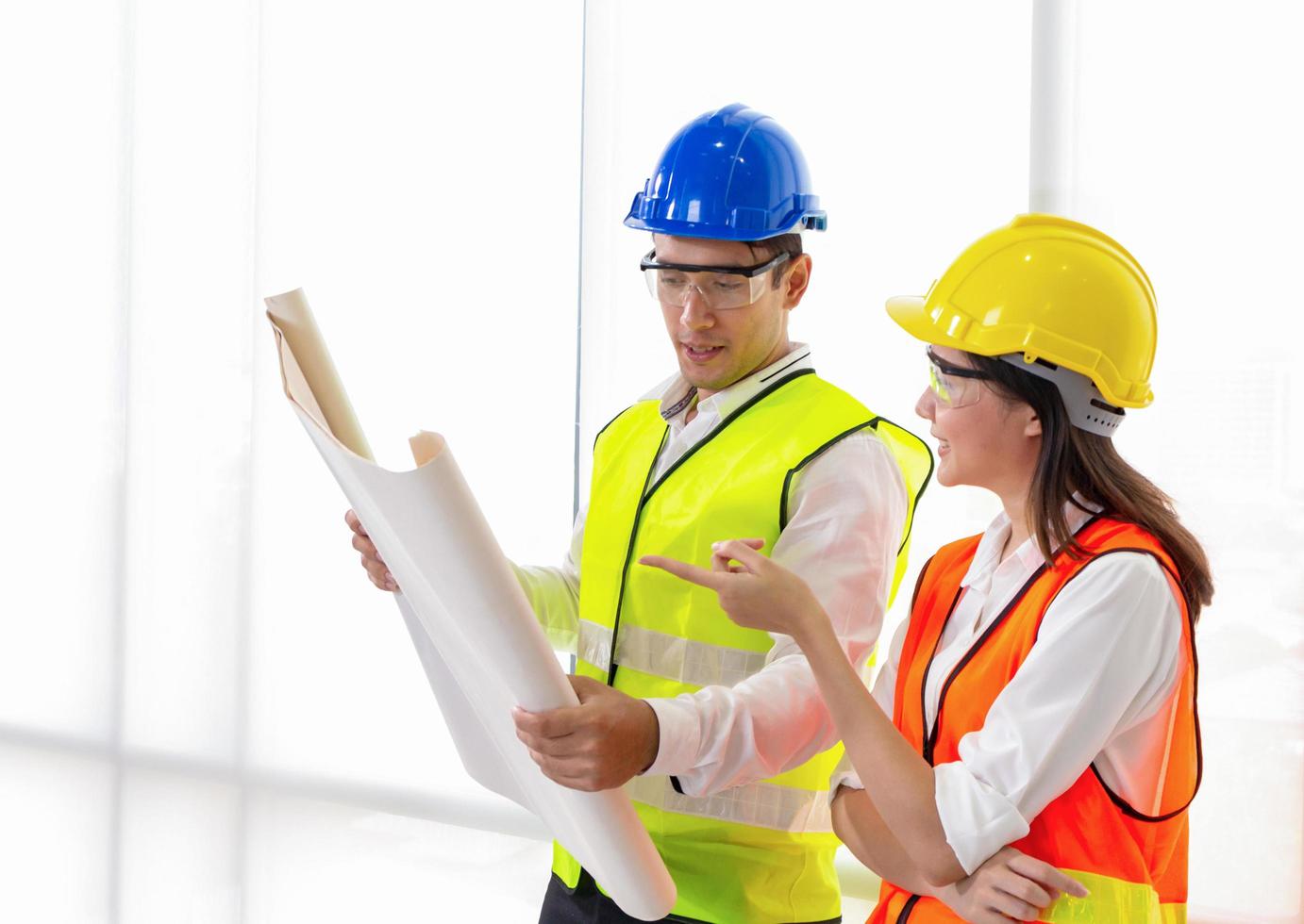 Young engineers collaborate at office photo