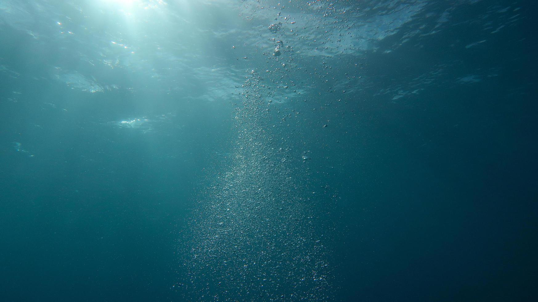 Bubbles under water photo