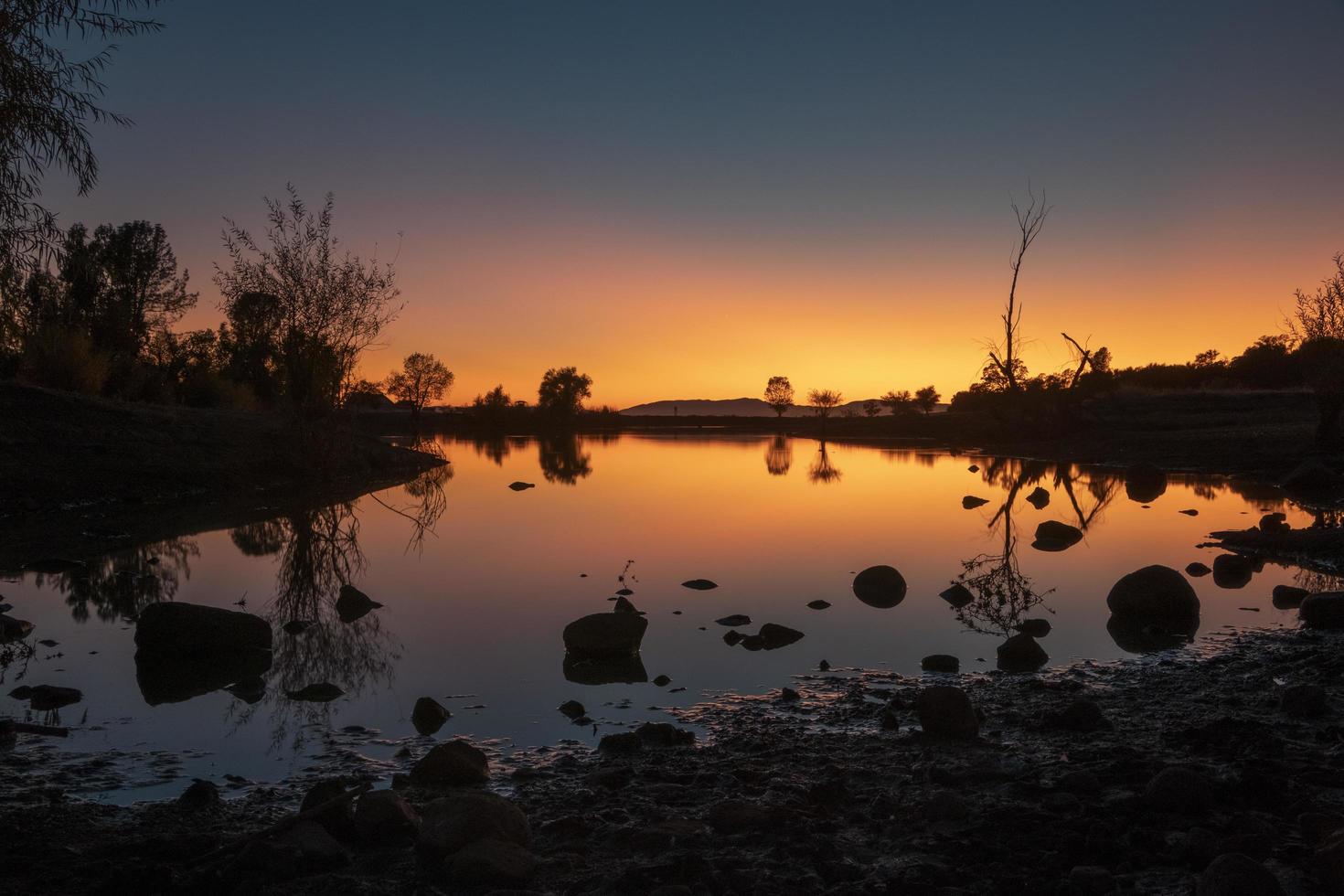 Body of water during sunset photo