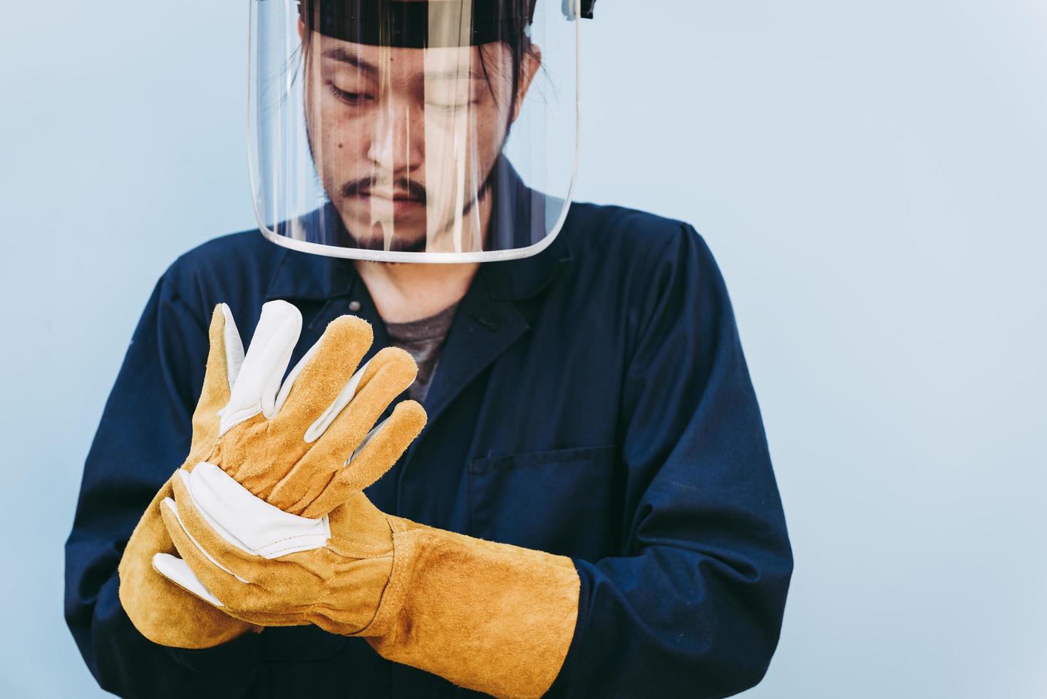 Welding worker wears personal safety equipment  photo