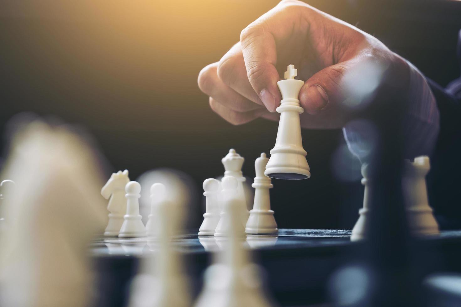 Close up of hands playing chess game  photo