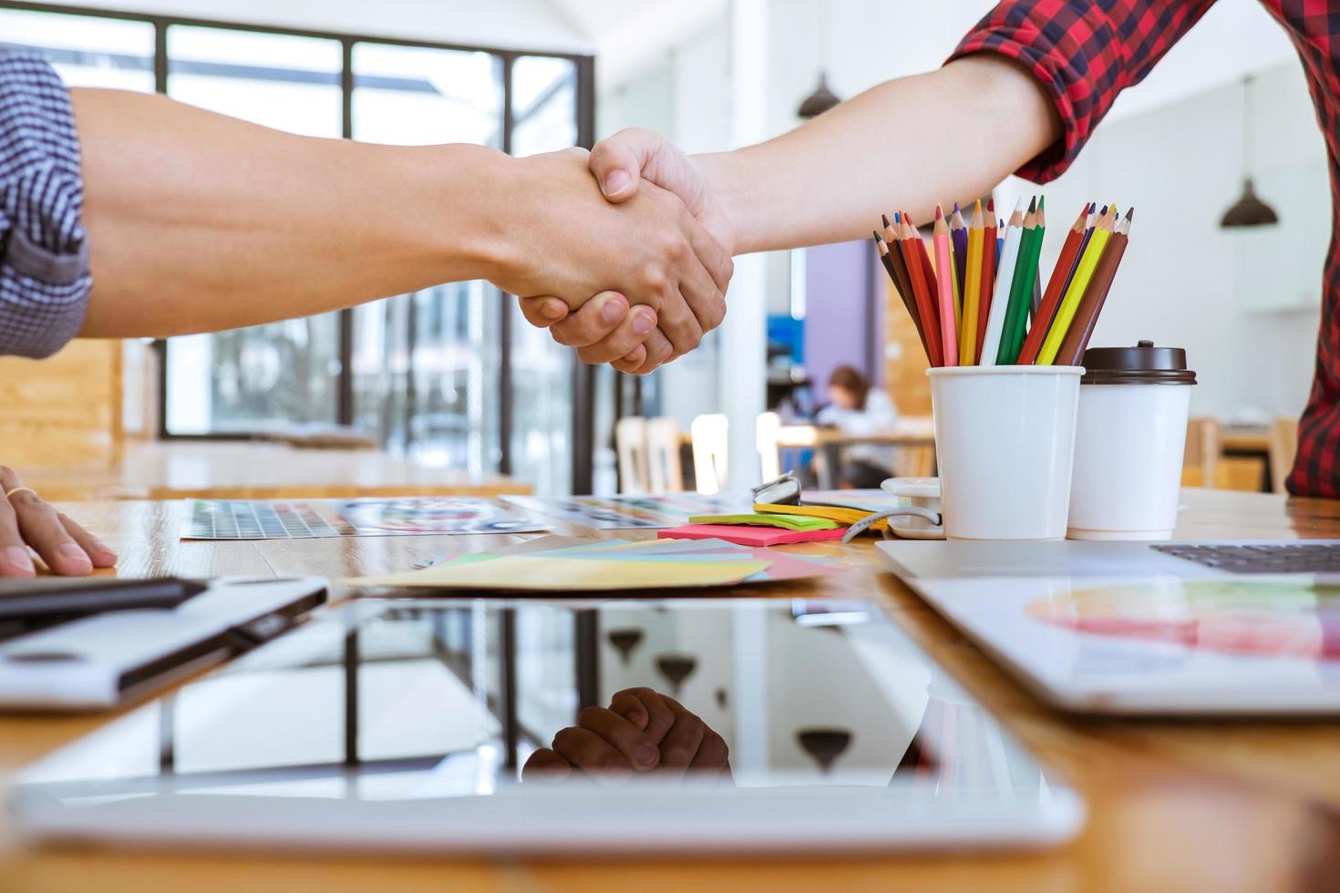 Two people shaking hands after successful meeting photo