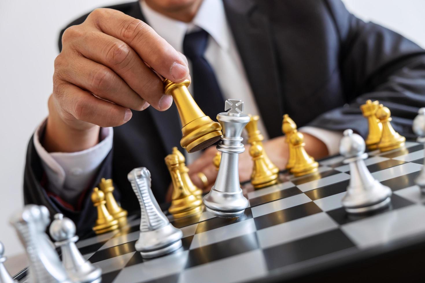 Businessman playing chess  photo