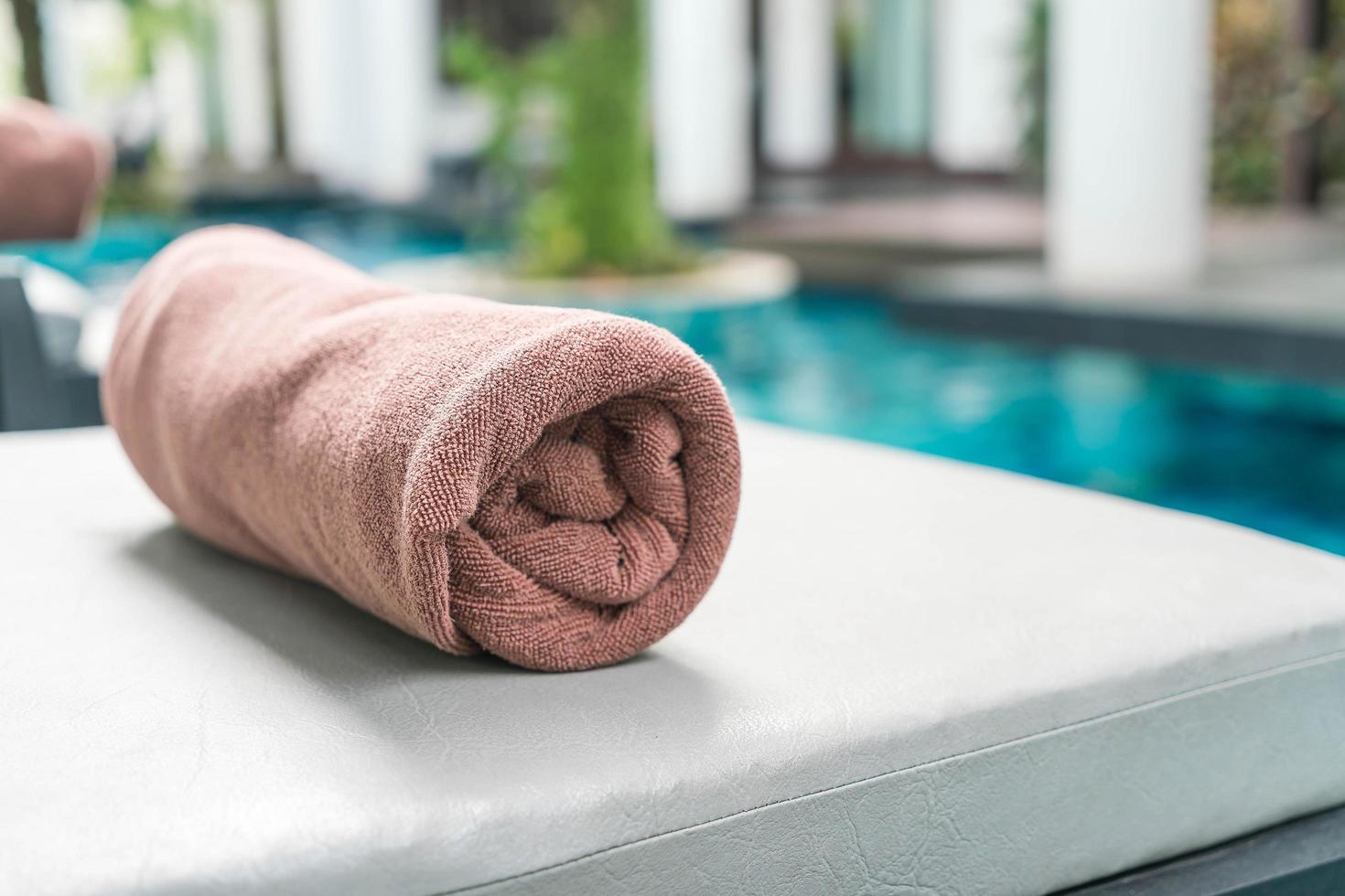 Pool towel on chair decoration around swimming pool photo