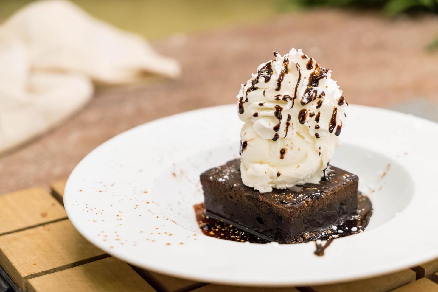 Brownie sundae with a scoop of vanilla ice cream photo