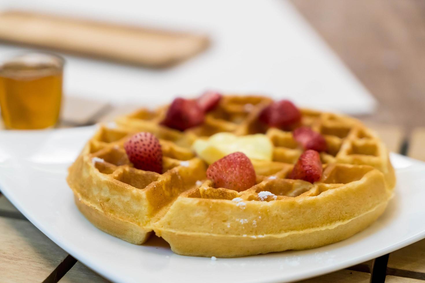 Butter waffle with honey and strawberry photo