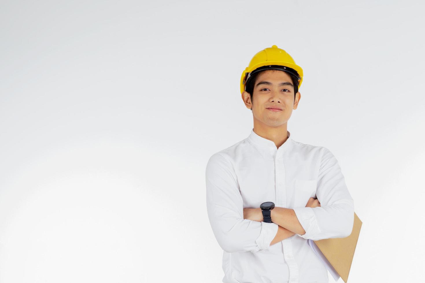 Engineer wearing hardhat with clipboard photo