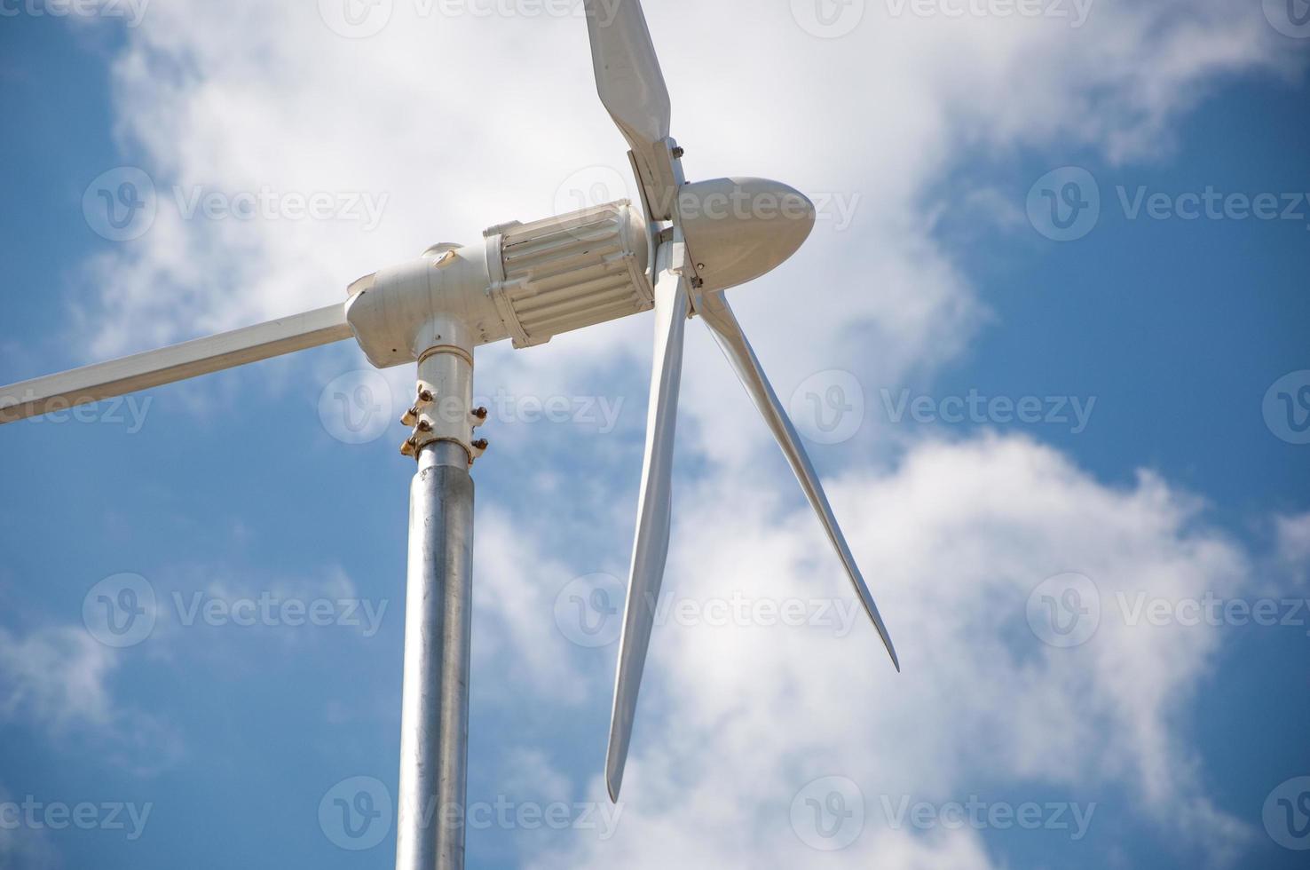 Closeup of wind turbine producing alternative energy photo