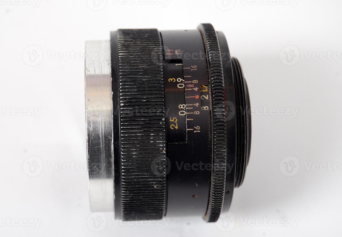 An Old Manual Control Camera Lens Isolated On White photo