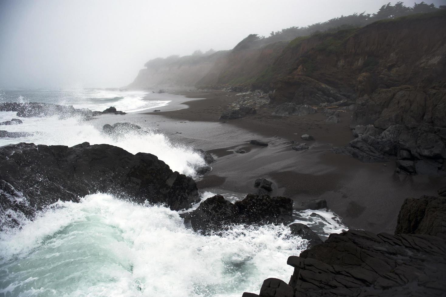 Waves splashing on seashore photo