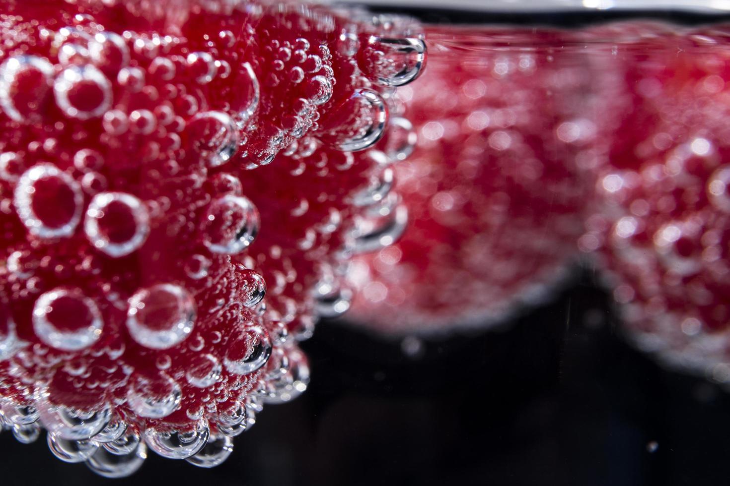 Pink berries in water photo