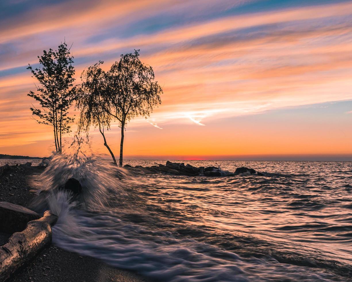 Waves crashing on the shore photo