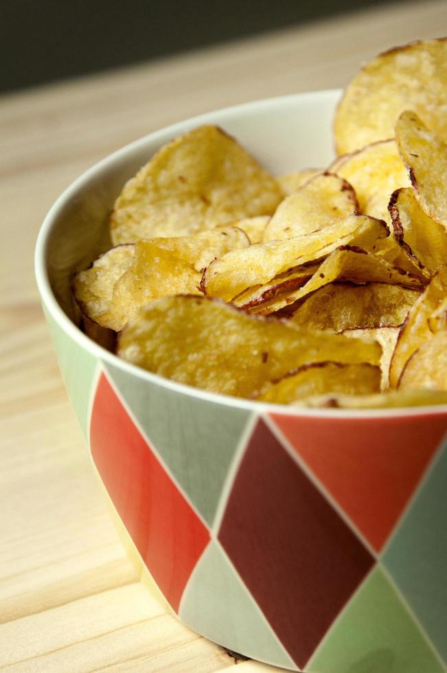 Potato chips in bowl photo