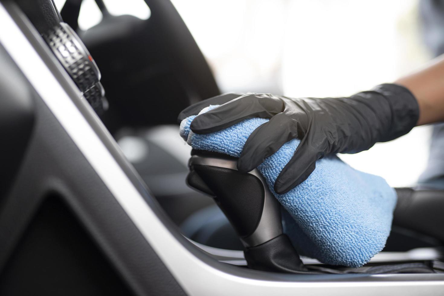 Person cleaning interior of car photo