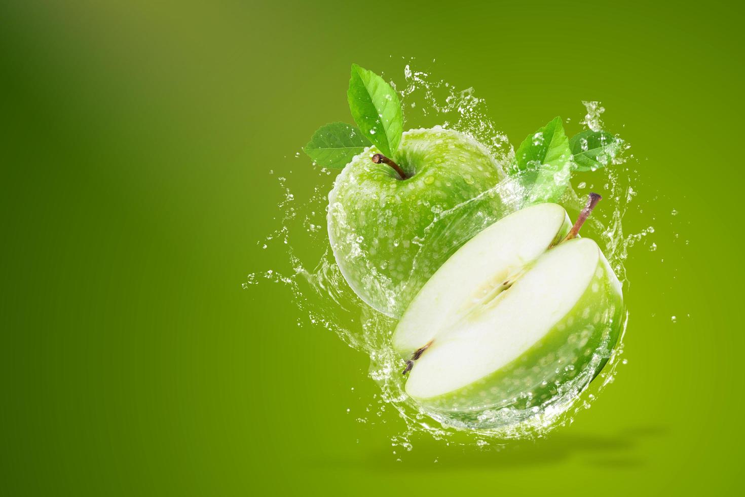 Water splashing on fresh green apple  photo