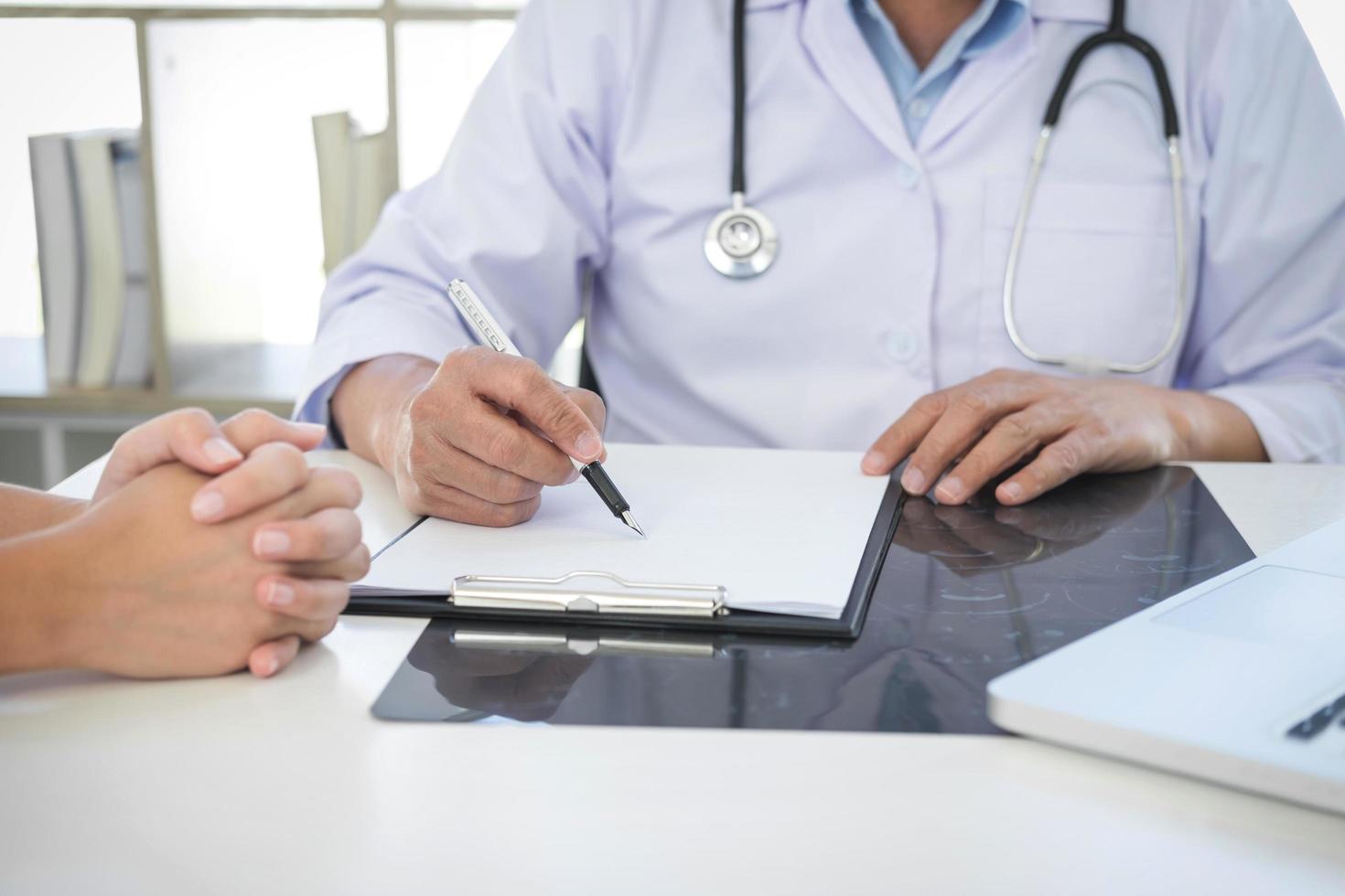 Doctor meets with patient  photo