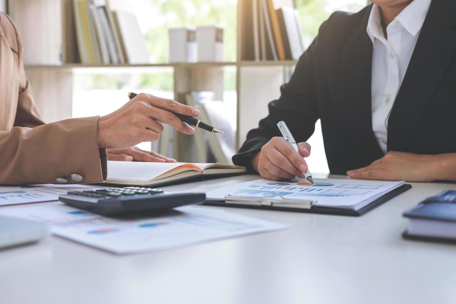 Co working conference, Business team meeting present, investor colleagues discussing new plan financial graph data on office table with laptop and digital tablet, Finance, accounting, investment photo