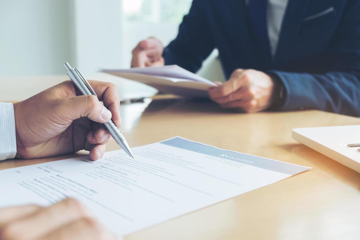 Executive reading a resume during a job interview  photo