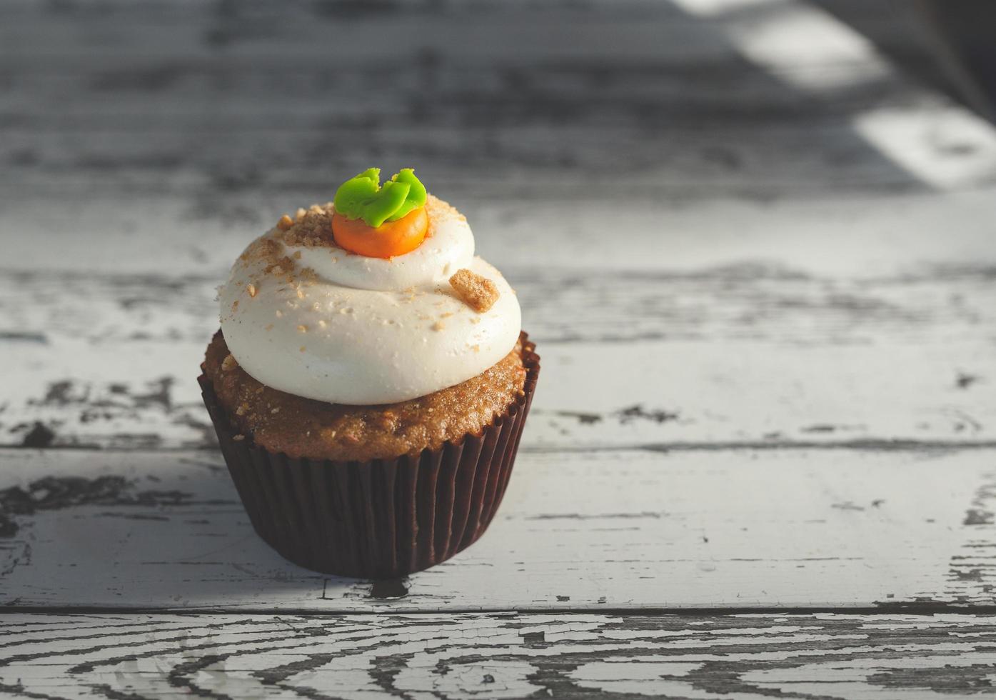 Cupcake on wooden table photo