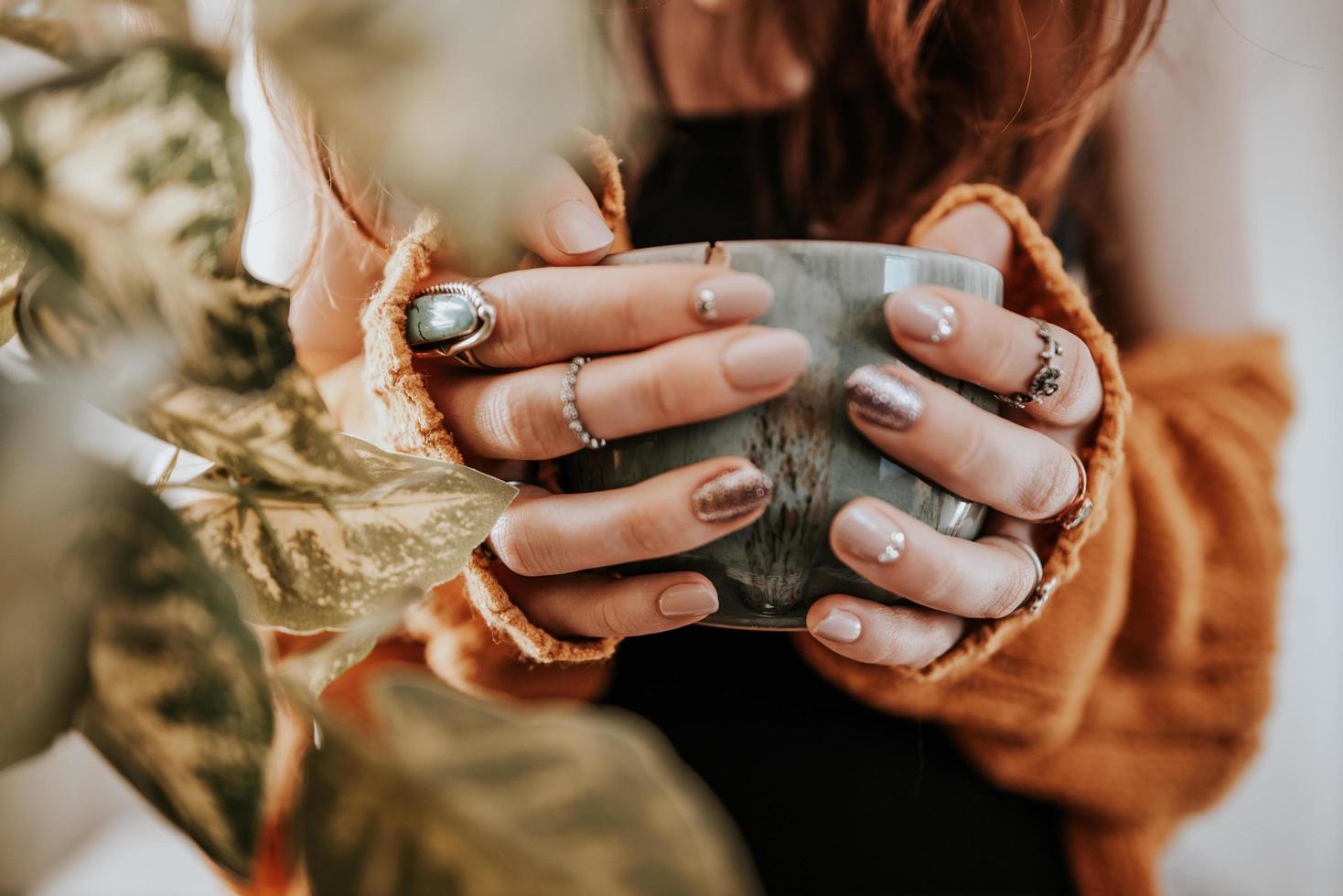 Person holding coffee mug photo