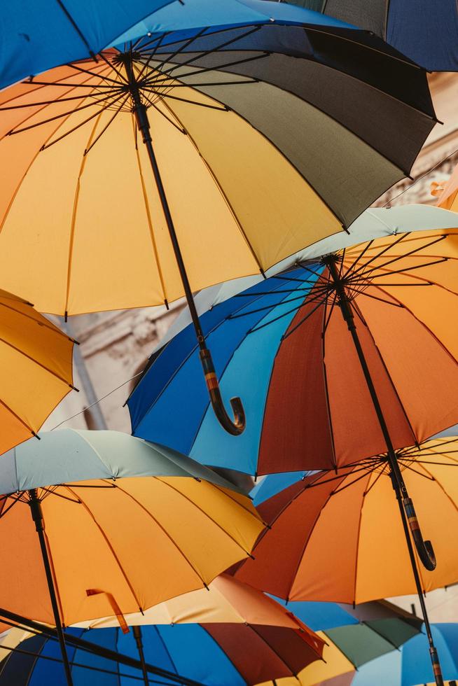 Looking up at colorful umbrellas photo
