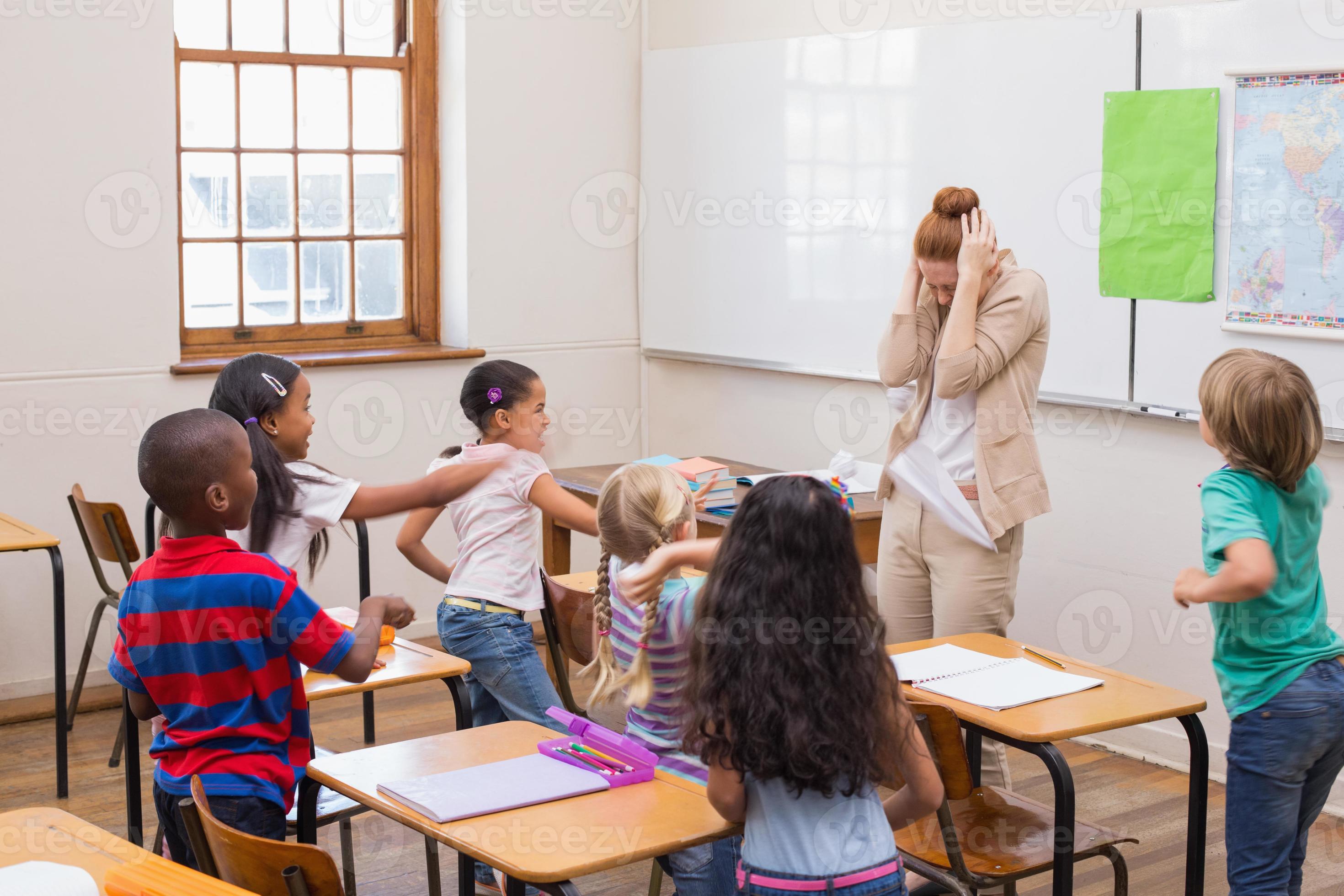 Naughty pupils in class 1242947 Stock Photo at Vecteezy