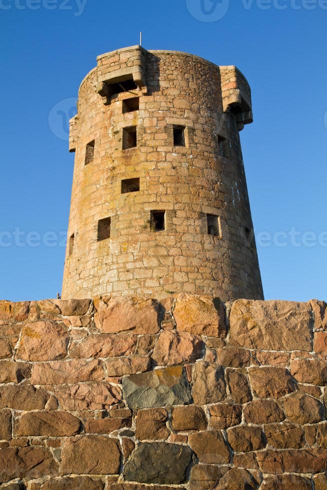 Historic Le Hocq Tower on the Jersey (UK) coast photo