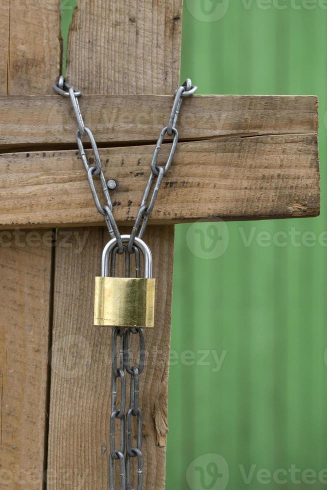 Padlock on a wooden wall photo