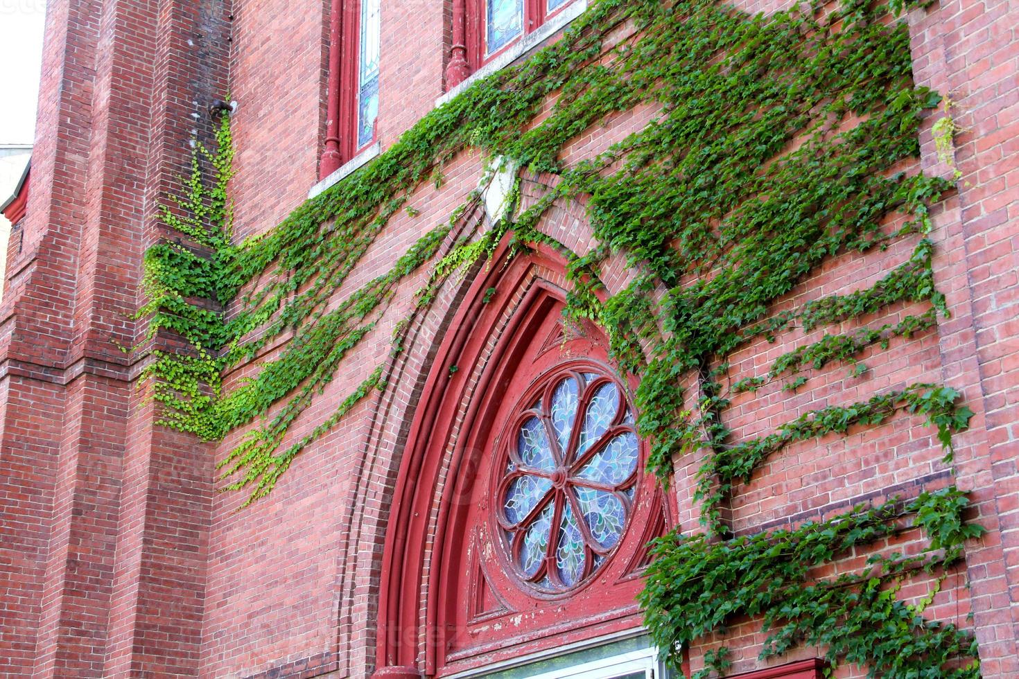 Historic, red brick church with ivy, downtown Keene, New Hampshire. photo