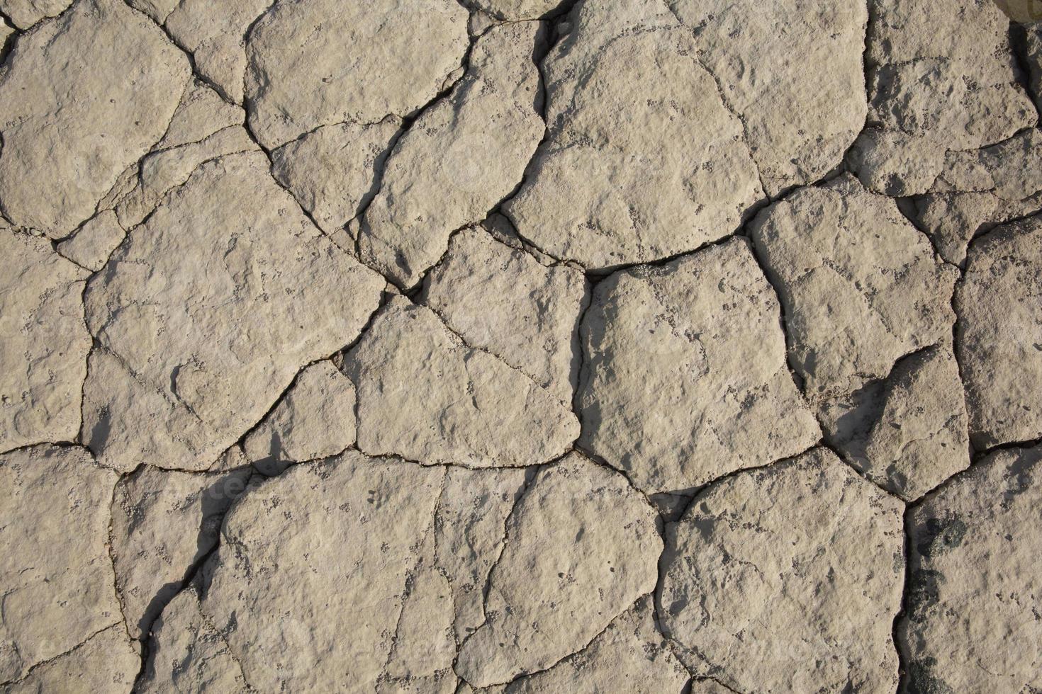 Rock surface with cracks an uneven background texture illustration photo