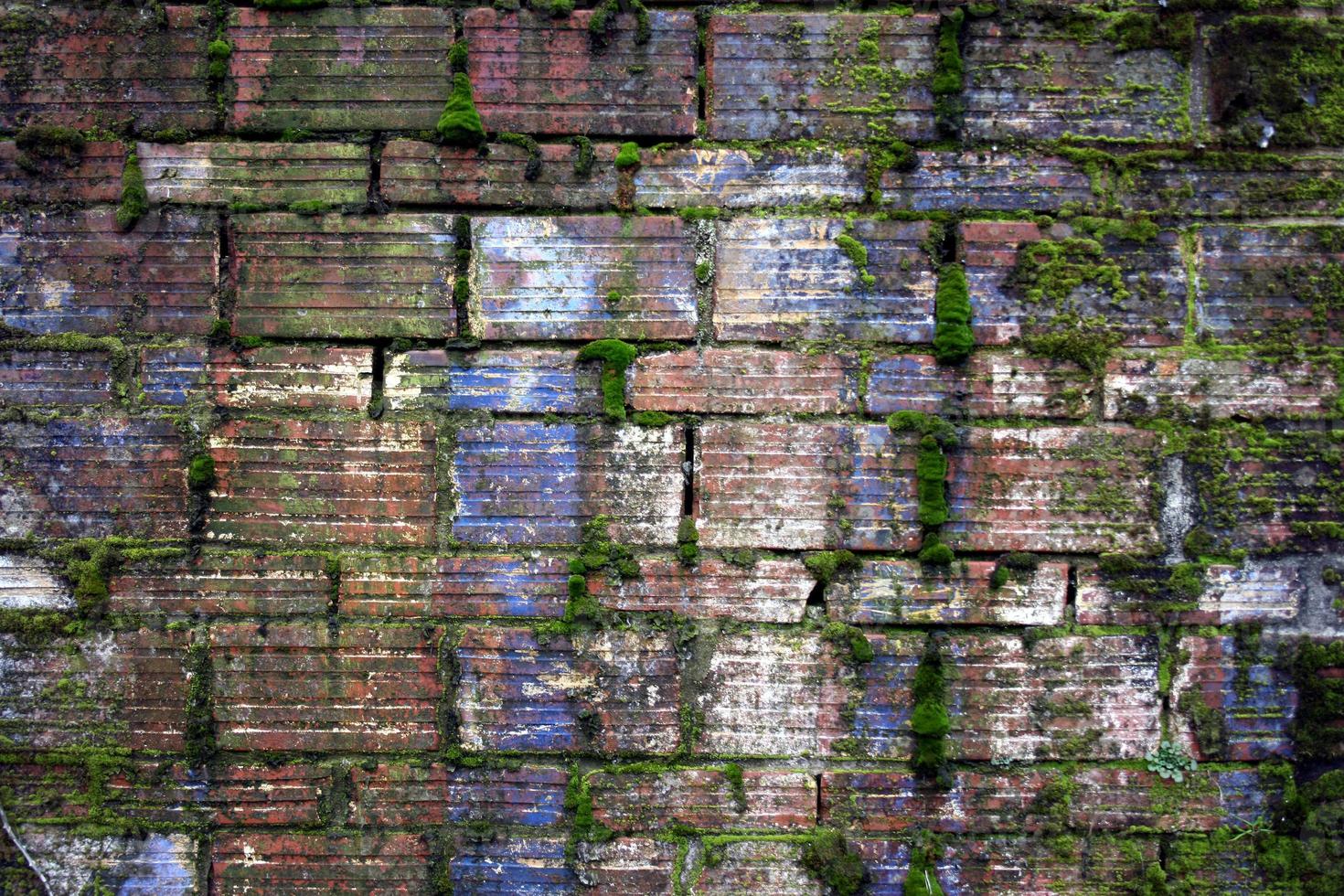 Grunge lined blue green brick facade photo
