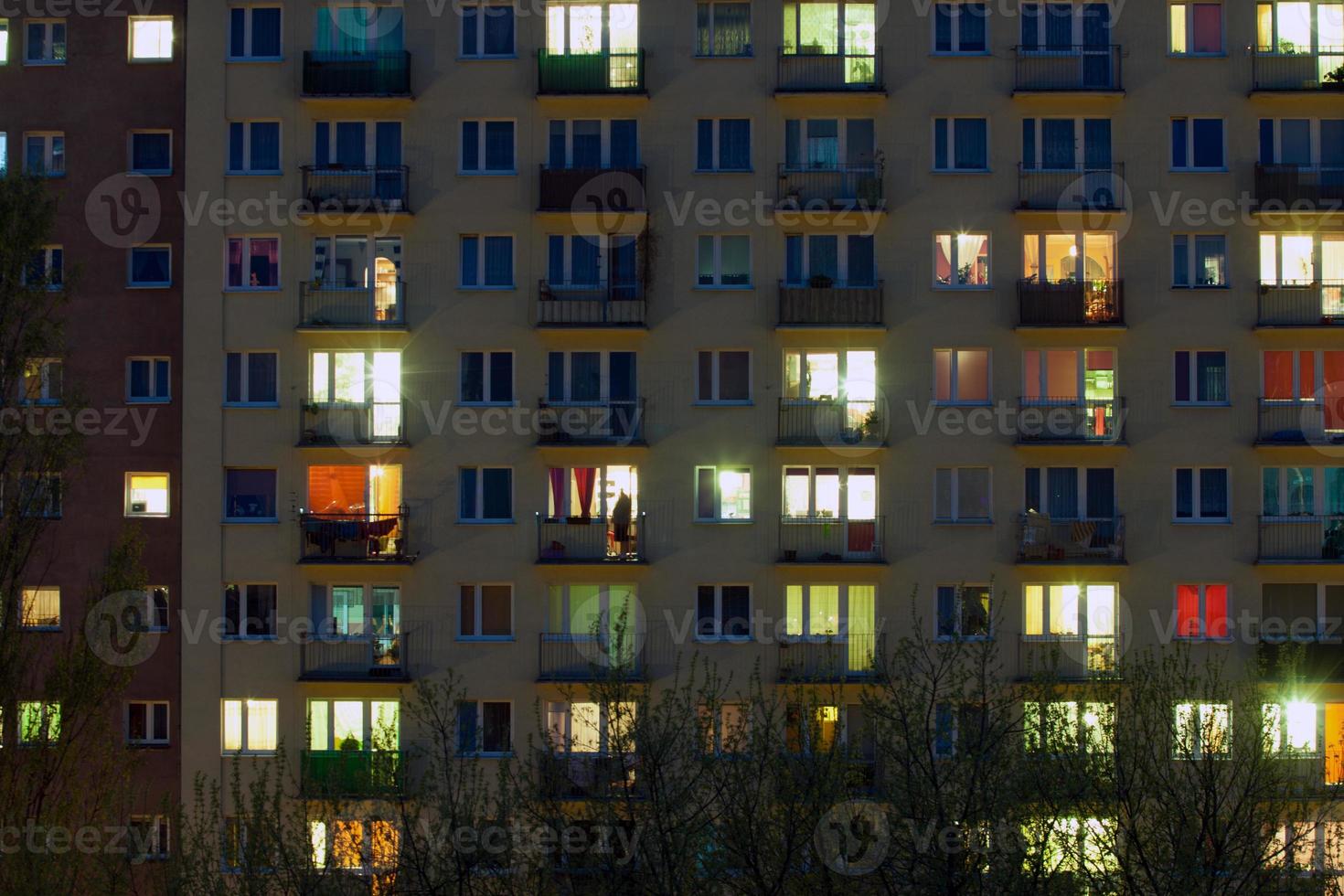 window of an apartment block at night photo