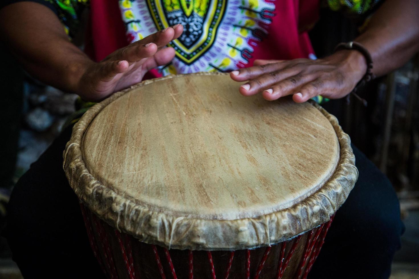 Hands on bongo drum photo