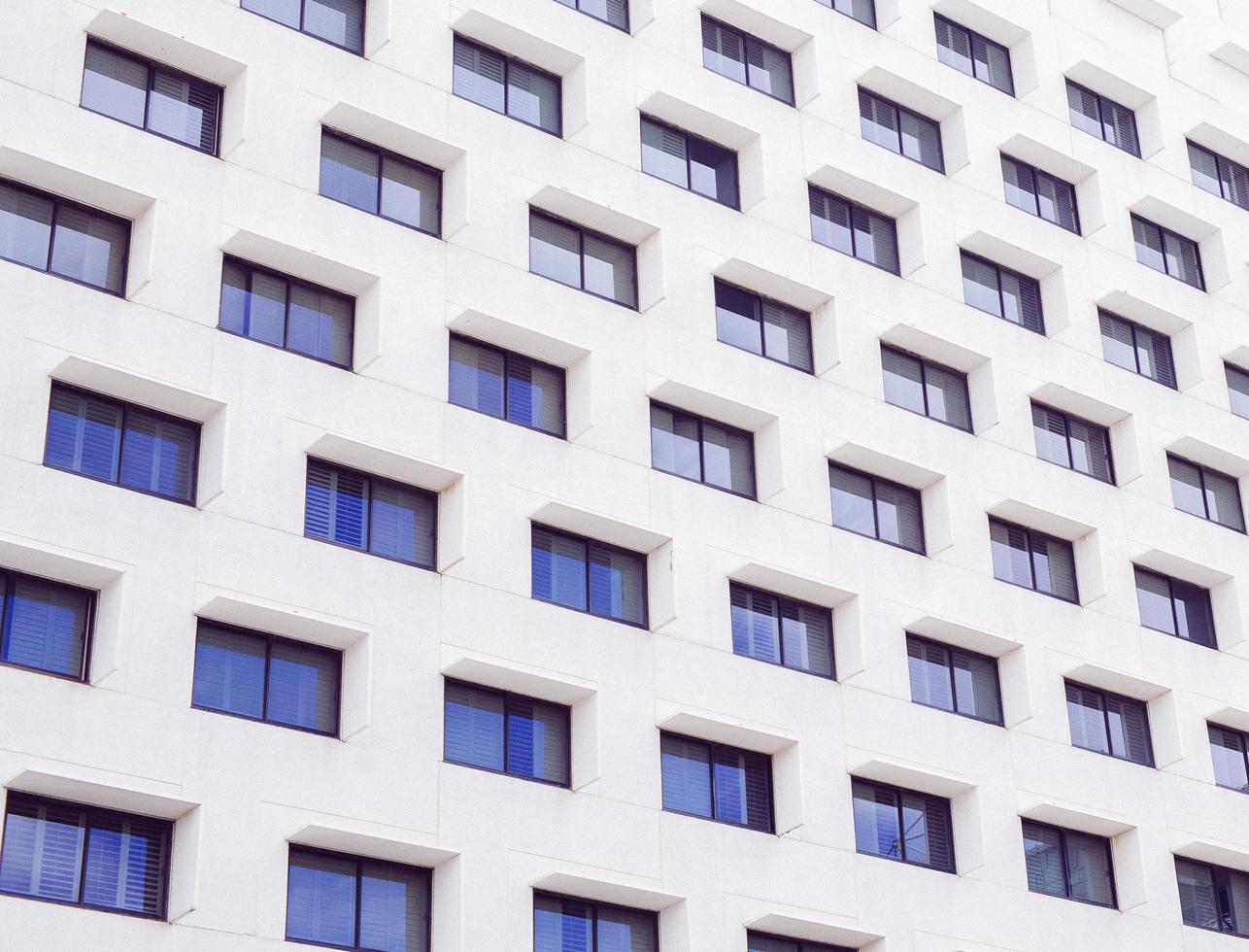 White concrete building with windows photo