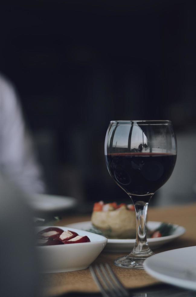 Red wine on table photo