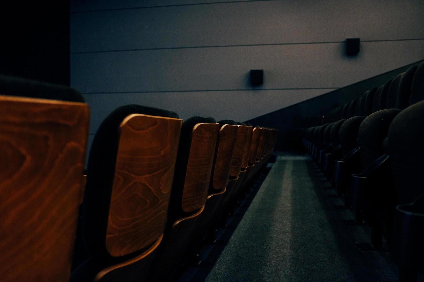 Brown wooden chairs in theater photo