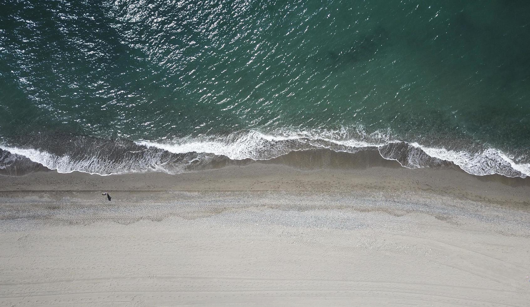 Aerial photography of person on shore photo