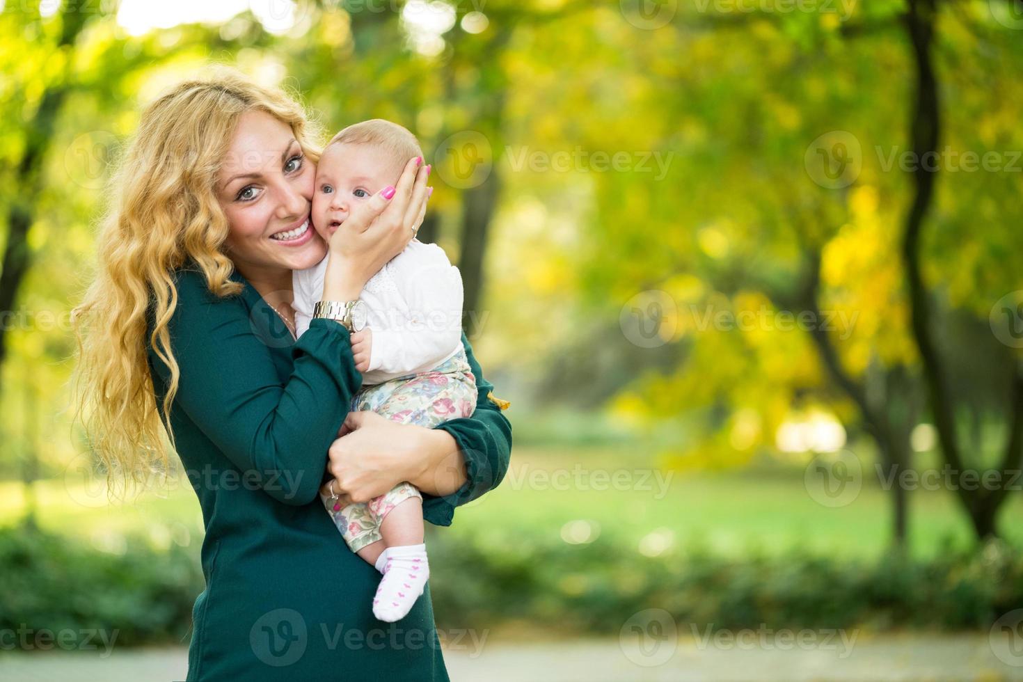 Portrait of young mother with baby photo