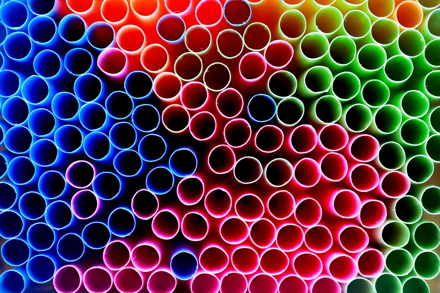 Disposable plastic drinking straws photo