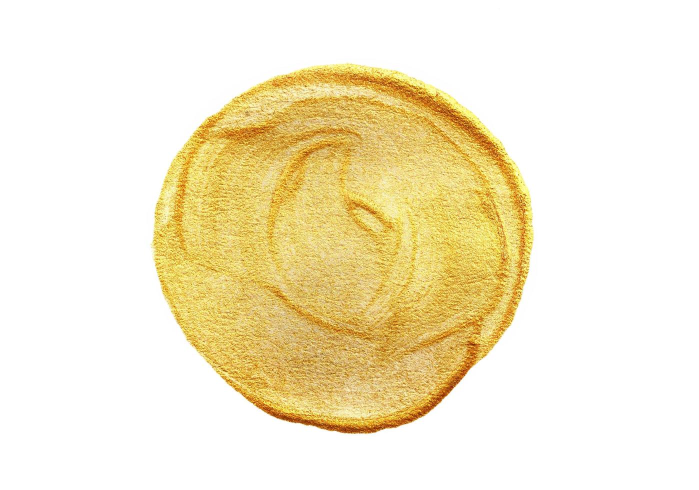 Gold painted circle on white background photo