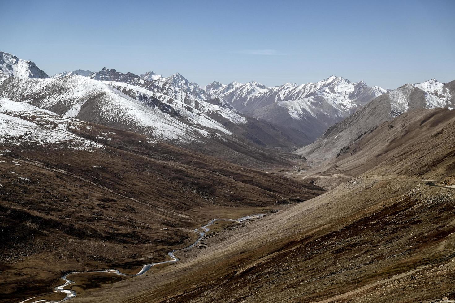 Landscape of snow capped mountain range photo