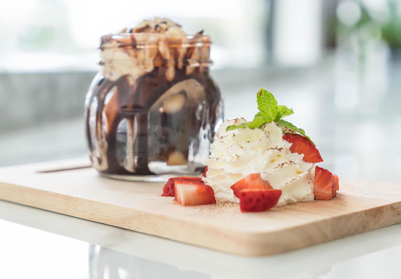Chocolate fudge dessert with whipping cream 1259528 Stock Photo at Vecteezy