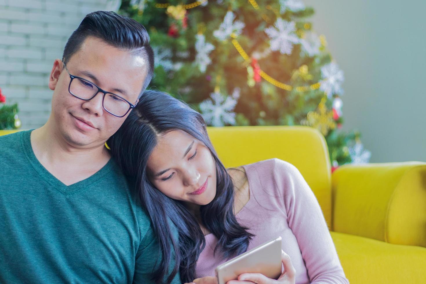 Couple relaxing in a living room photo