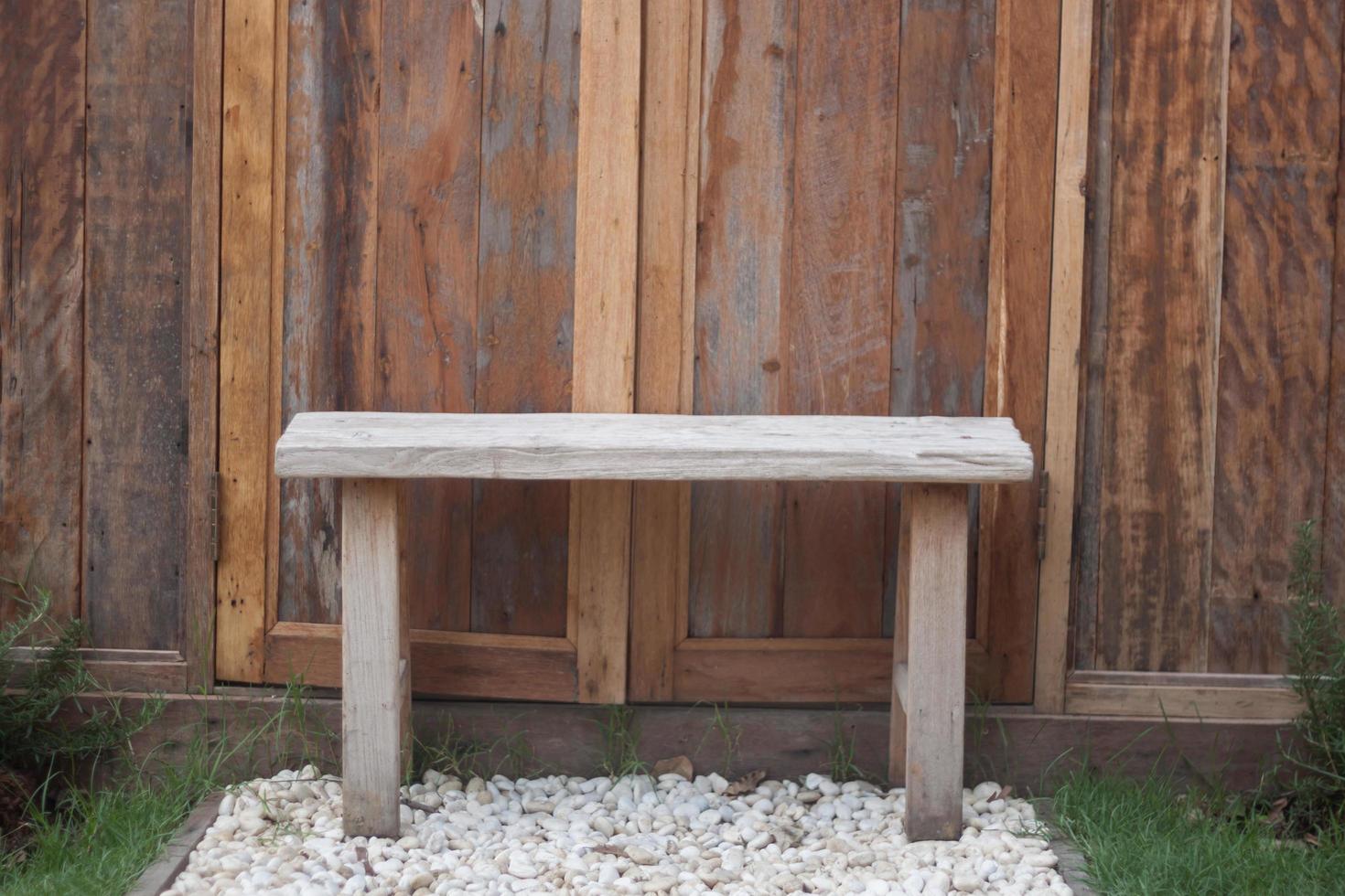 Wooden bench on white gravel  photo