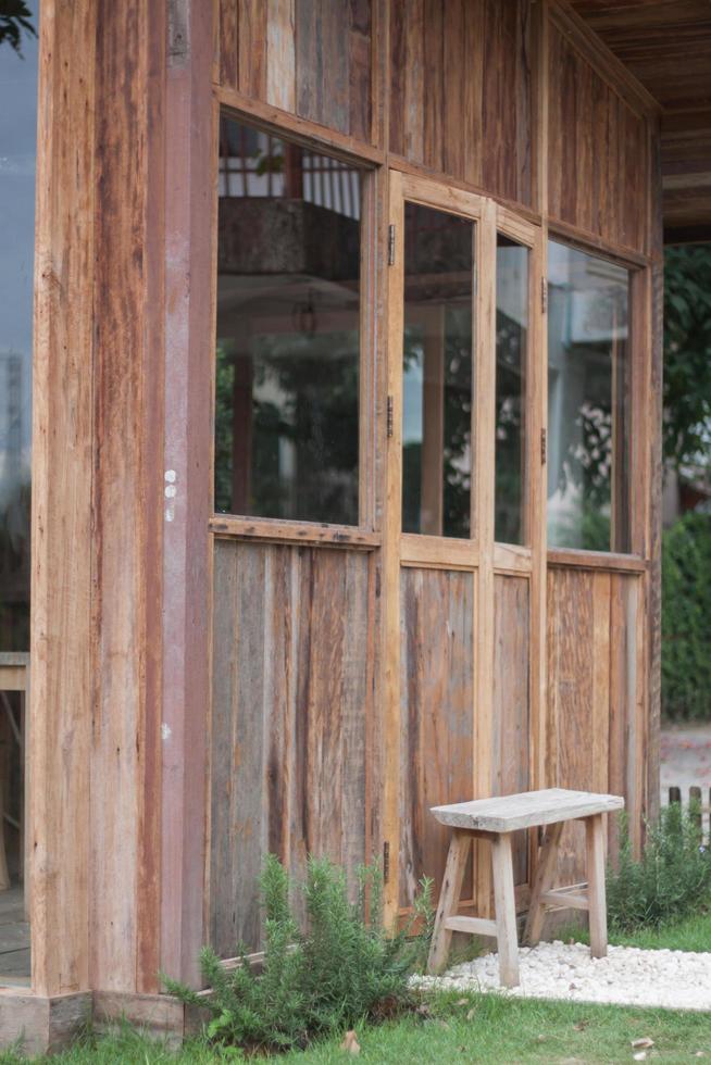 Wooden bench next to brown building photo